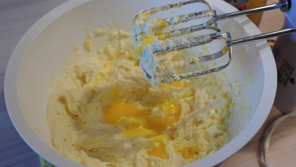 Fresh eggs being used to emulsify cookie batter